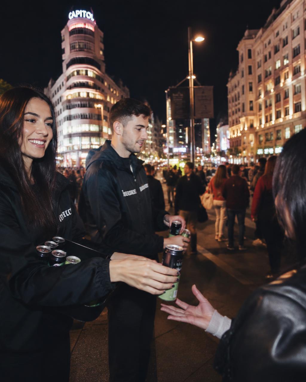 Street team handing LVF cans to fans in Madrid